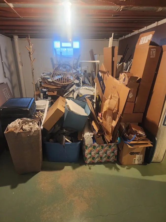 Roll-off dumpster container at job site for 15 Yard Dumpster Rental in Alma